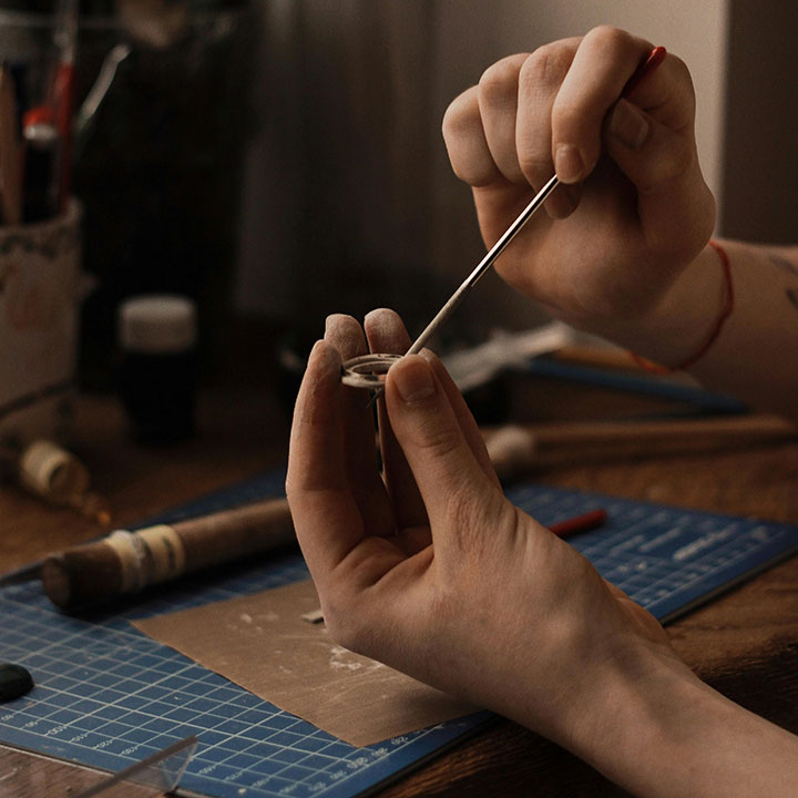 A person making jewellery