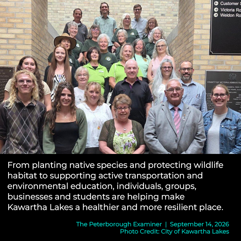 A group of men and women of all ages smile for a group photo. Text below the image reads: From planting native species and protecting wildlife habitat to supporting active transportation and environmental education, individuals, groups, businesses and students are helping make Kawartha Lakes a healthier and more resilient place. The Peterborough Examiner. Photo Credit: City of Kawartha Lakes